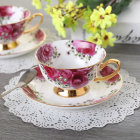 Vintage Floral Teacup and Saucer with Gold Trim on Lace Doily