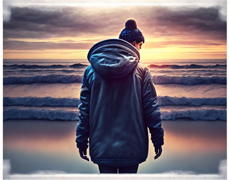 Person in leather jacket and beanie at vibrant ocean sunset