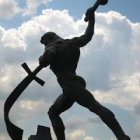 Warrior in Horned Helmet with Two Axe-like Weapons in Dramatic Setting