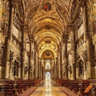 Luxurious Hall with Golden Columns, Arches, Chandeliers, and Intricate Designs