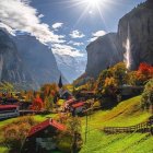 Scenic landscape with steam train, stone bridge, waterfall, colorful flora, and mountains