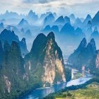 Scenic karst mountains and river with traditional boats