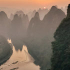 Misty river sunrise with karst mountains and pagodas