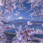 Surreal landscape painting: Mount Fuji, full moon, blossoming trees, traditional houses, spotted