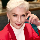 Stylized woman with platinum blonde hair in red jacket portrait.