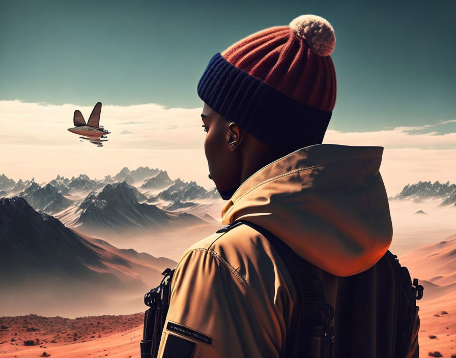 Person in beanie gazes at plane over rugged desert landscape