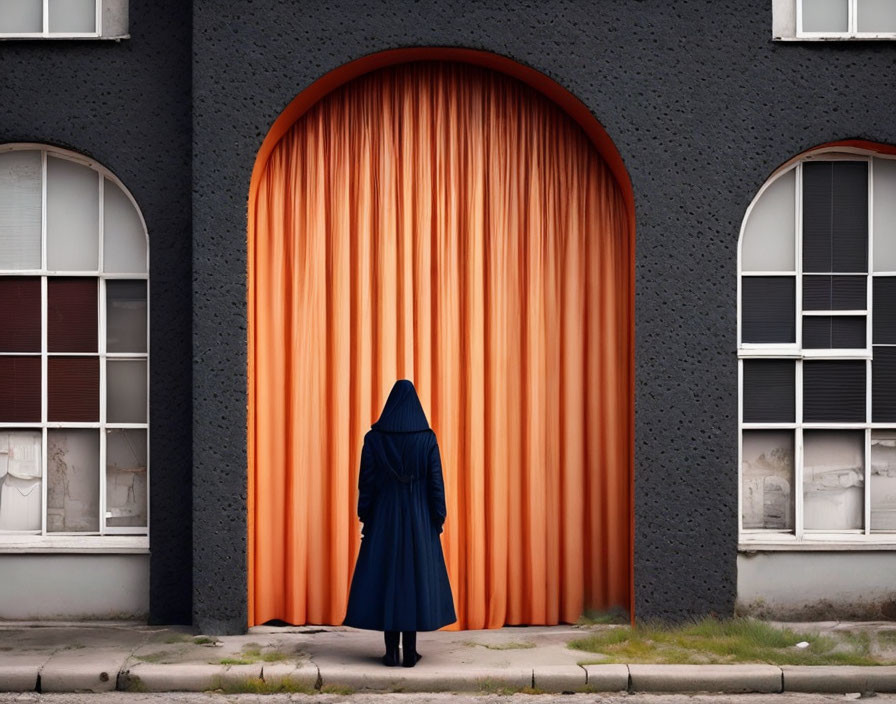 Figure in Dark Cloak in Front of Orange Curtain and Windows on Grey Day