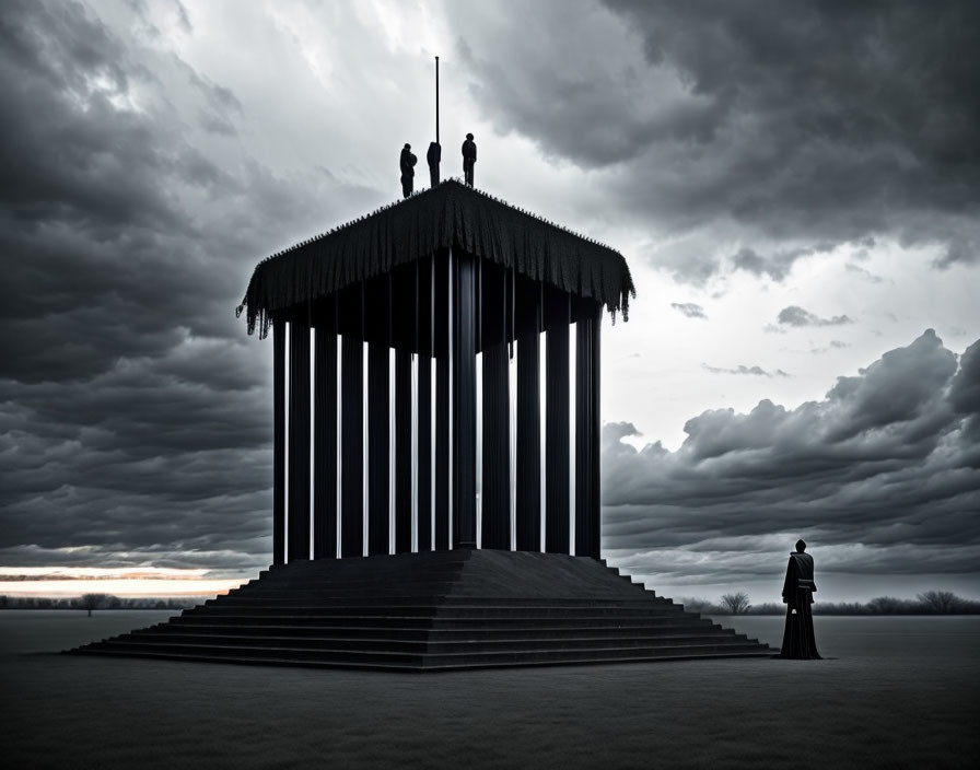 Figures on dark structure under dramatic sky with lone figure at base