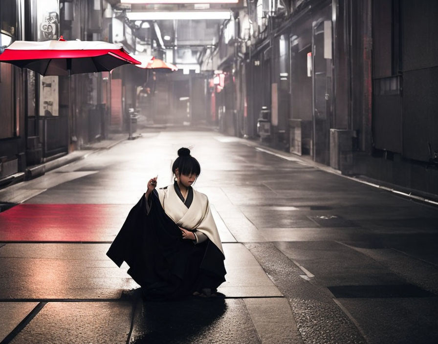 Traditional Japanese attire person with red umbrella on moody, lit street at dusk