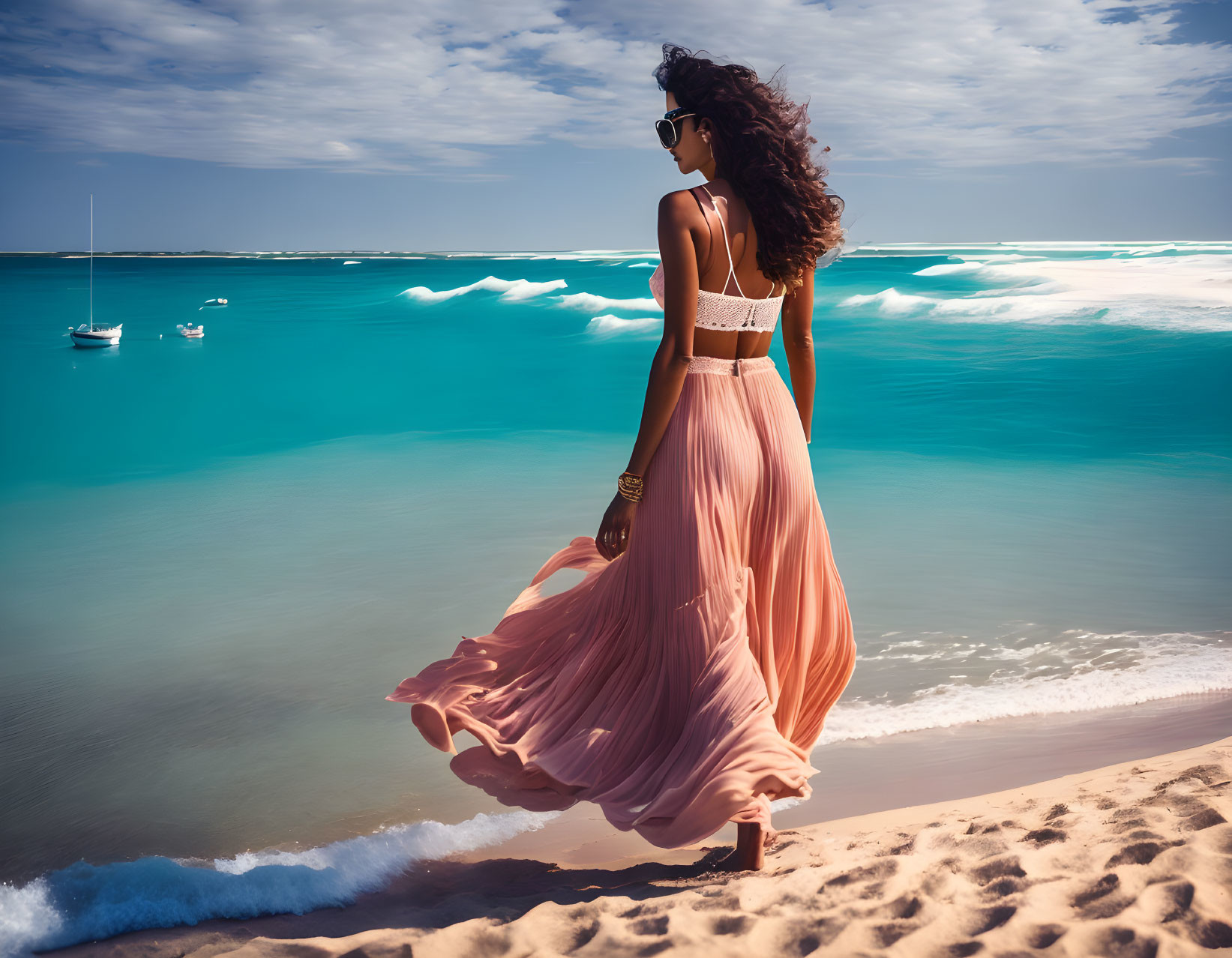 Woman in Peach Dress on Beach with Sailboat in Turquoise Sea