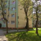 Urban park setting with modern buildings and transparent spherical structure