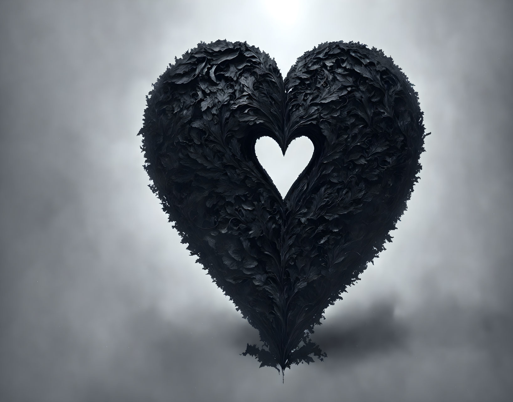 Feather-textured black heart with heart-shaped cutout on grey background