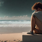 Person sitting on sandy beach under twilight sky with emerging stars.