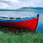 Colorful oil painting of red and blue boat on lake with sailboats, castle, and mountains under