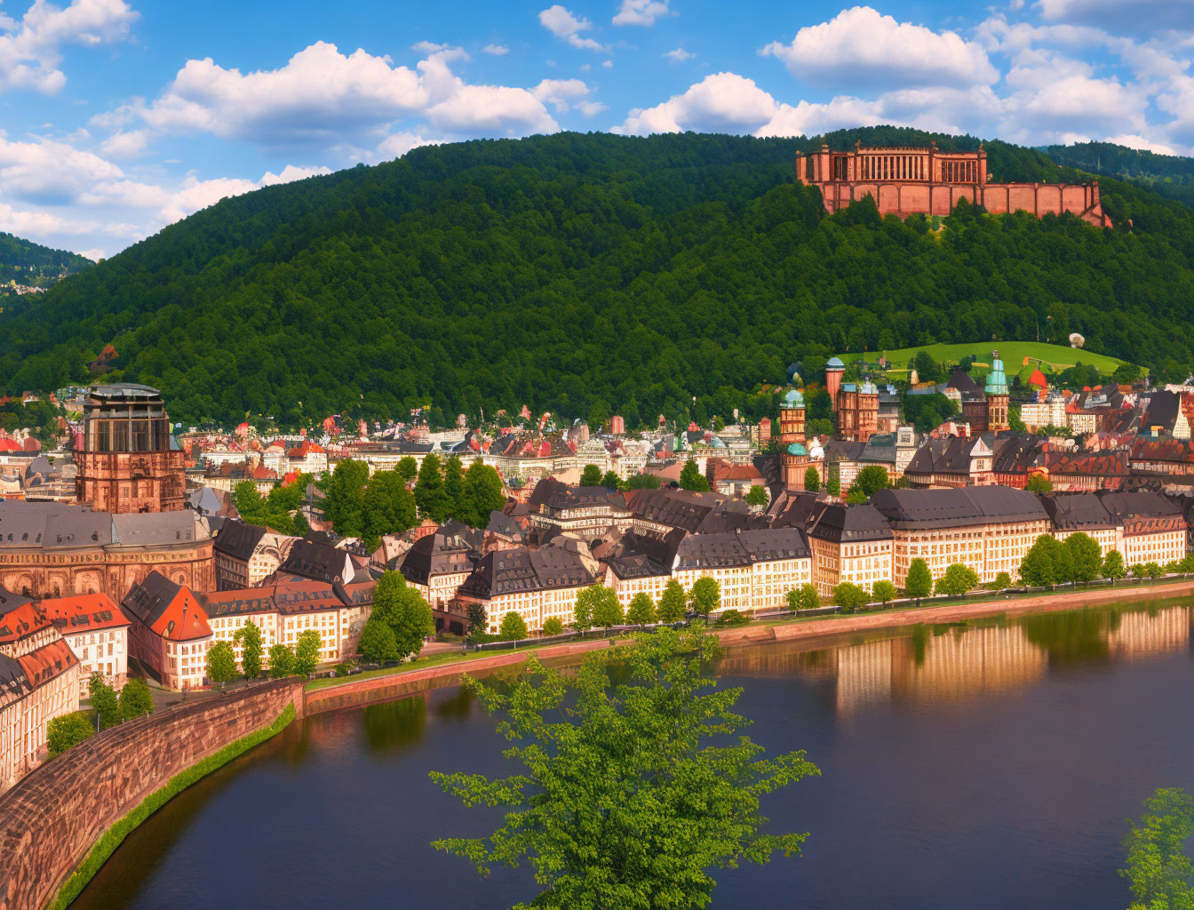 Historical European cityscape with river, castle, and hill view