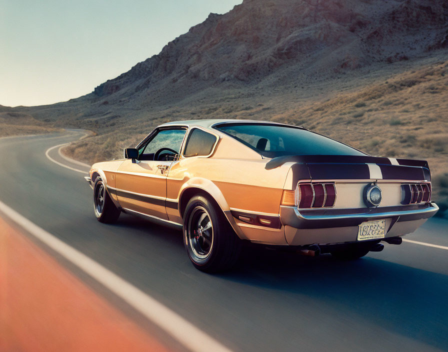 Classic Vintage Mustang Driving on Desert Road at Sunset