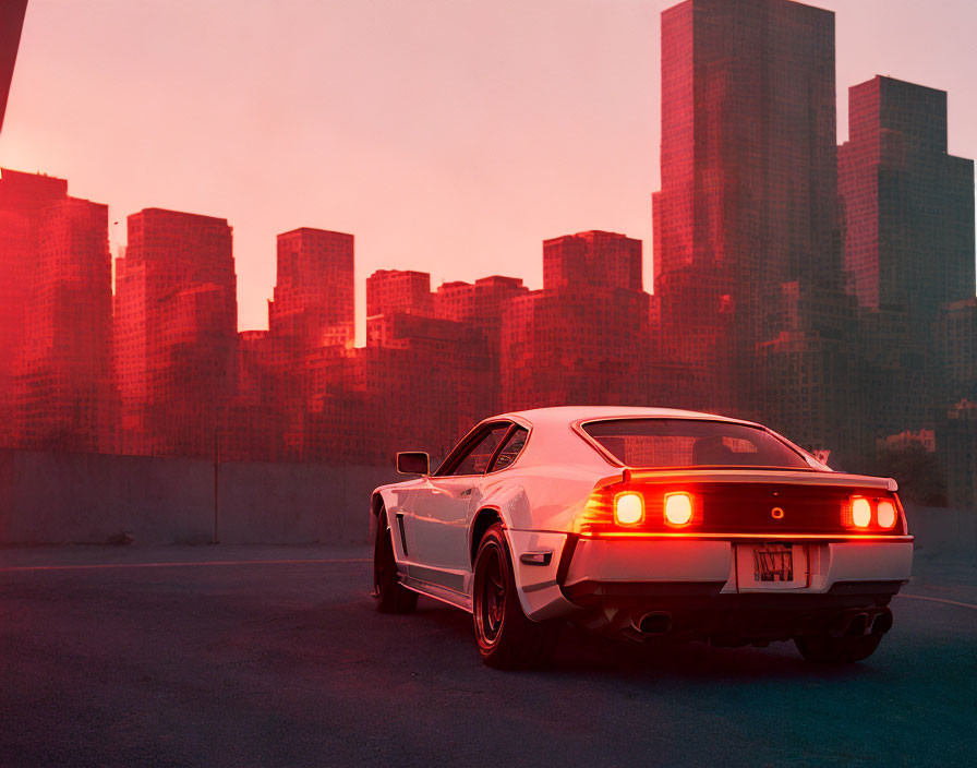 White Sports Car with Lit Tail Lights in City Twilight