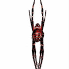 Stylized red and black spider illustration on white background