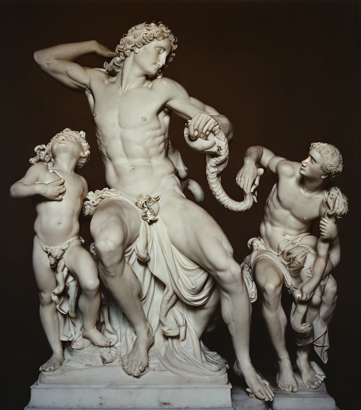 Marble sculpture of adult figure with serpents and cherubic children