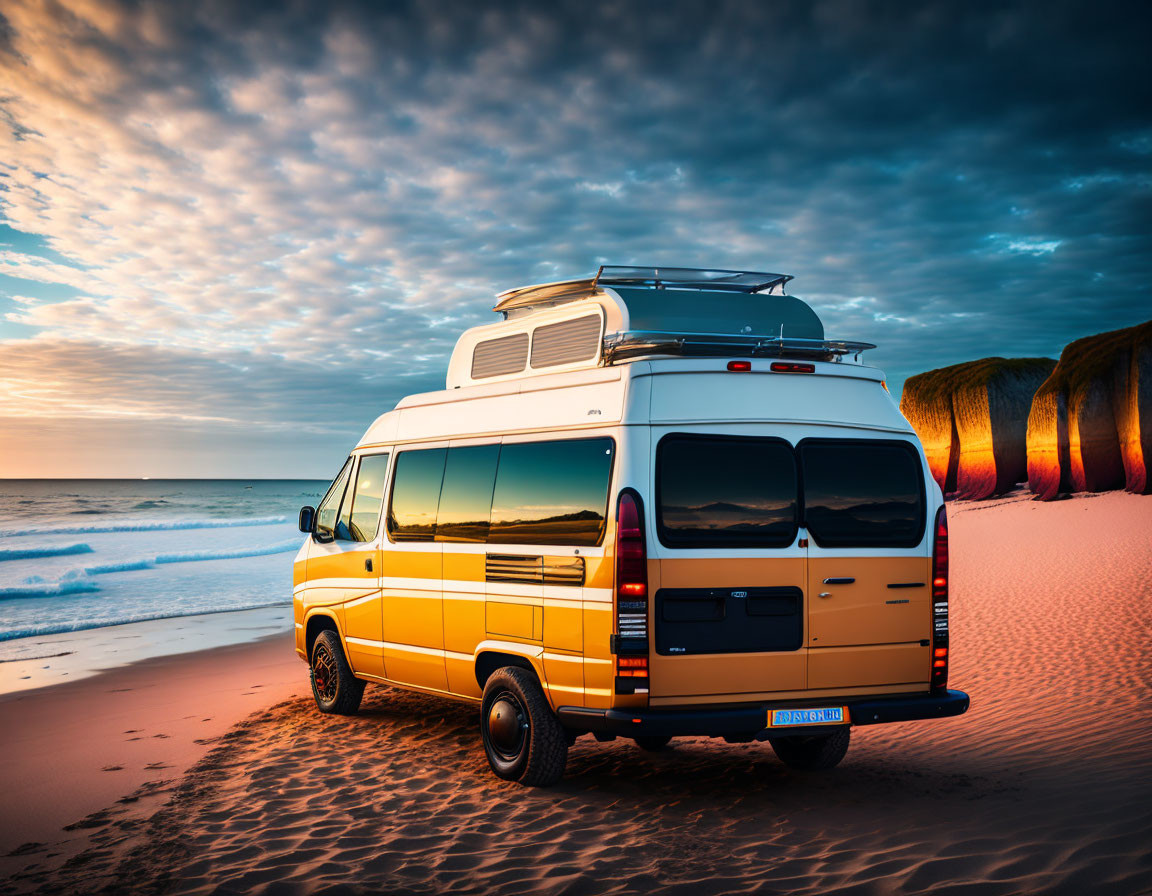 Yellow Camper Van on Sandy Beach at Sunset with Colorful Skies