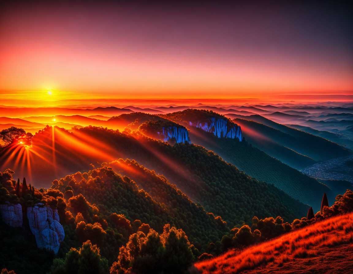 Colorful sunrise over misty mountain landscape