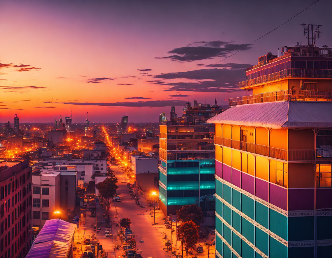 Colorful cityscape at sunset with illuminated streets