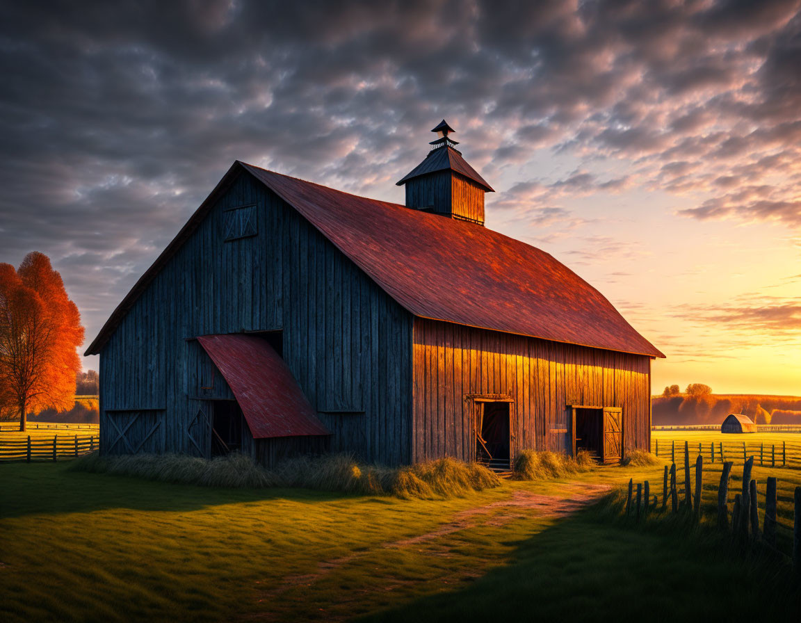 Sunset scene of rustic barn, warm light, fence, lush grass - tranquil pastoral atmosphere