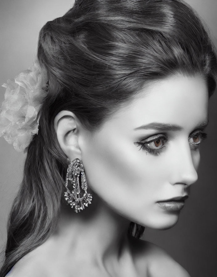 Monochrome portrait of woman with elegant makeup and chignon hairstyle