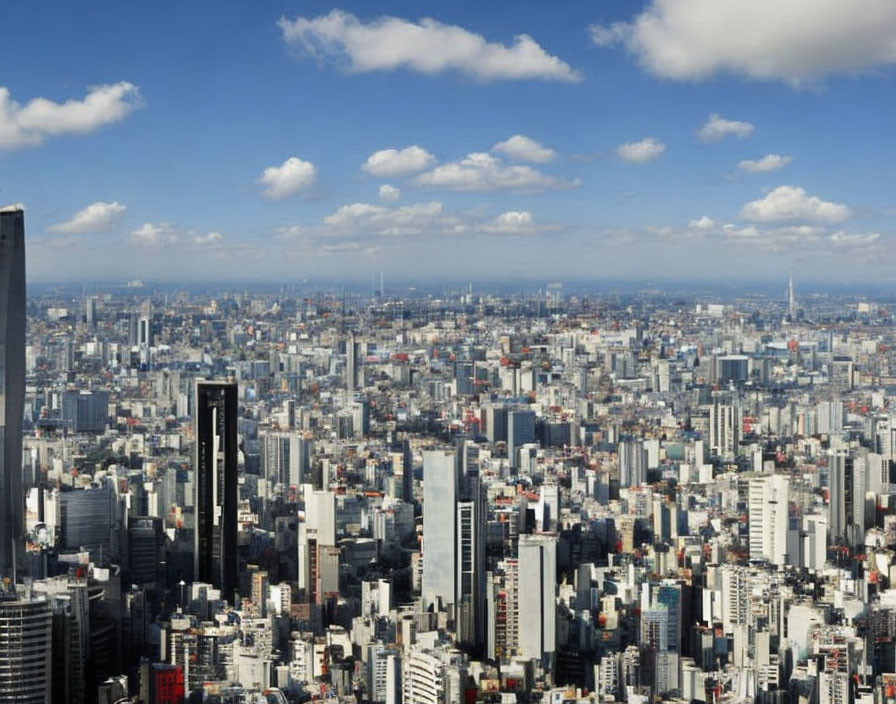 Cityscape with Dense Buildings Under Blue Sky