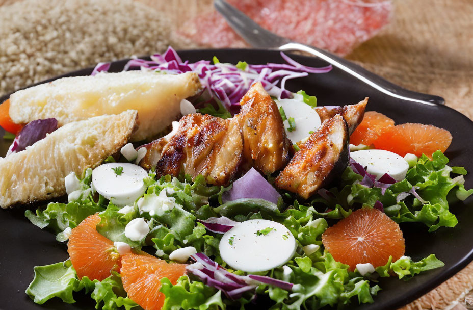 Grilled chicken salad with mixed greens, grapefruit, boiled eggs, red cabbage & creamy dressing