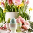 Colorful Pink Tulips and Easter Egg in Vase with Floral Background