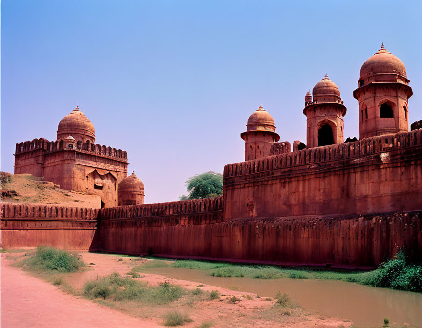 Ancient Red Sandstone Fort with Robust Bastions and Moat