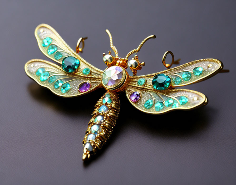 Dragonfly Brooch with Gold Tone and Turquoise Crystals on Dark Background