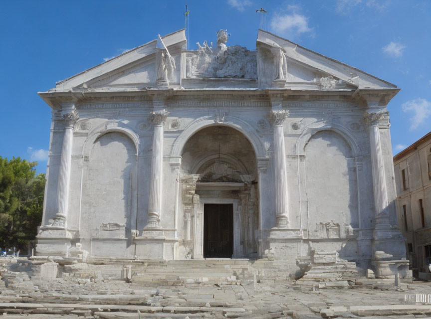 Neoclassical Church Facade with Corinthian Columns and Arched Entrance