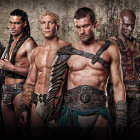 Five Men in Gladiator Costumes with Armor and Capes Stand Strong