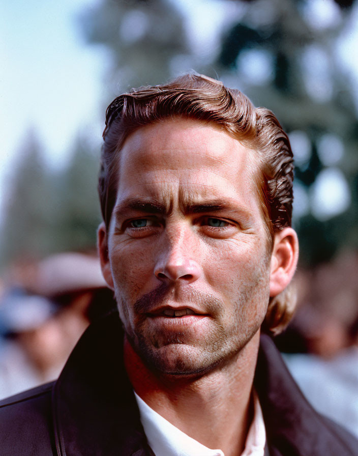 Man with Slicked-Back Hair and Leather Jacket