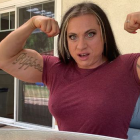 Muscular character in front double bicep pose, maroon top, house background