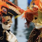 Elaborate Venetian carnival masks with vibrant colors and intricate designs