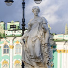 White Marble Statue of Curly-Haired Figure Against Cloudy Sky