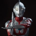 Futuristic red and silver armored suit with glowing visor.