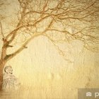 Person meditates under pink-flowered tree with bird cage and flying bird in serene setting