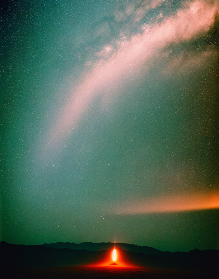 Rocket Launch at Dusk with Fiery Trail and Starry Sky