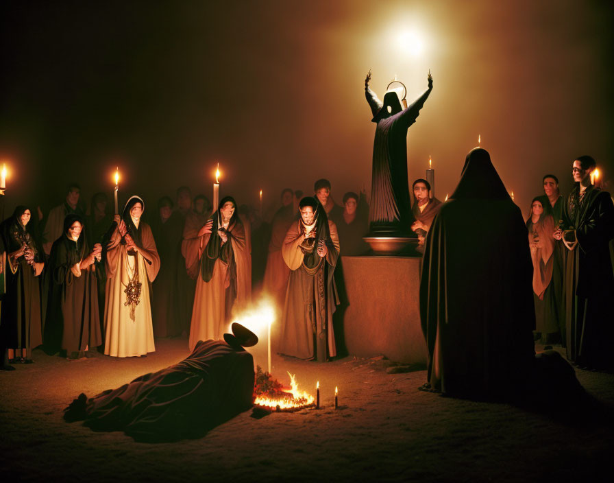 Group in robes with candles around central figure and hooded figure by small fire in mystical atmosphere.