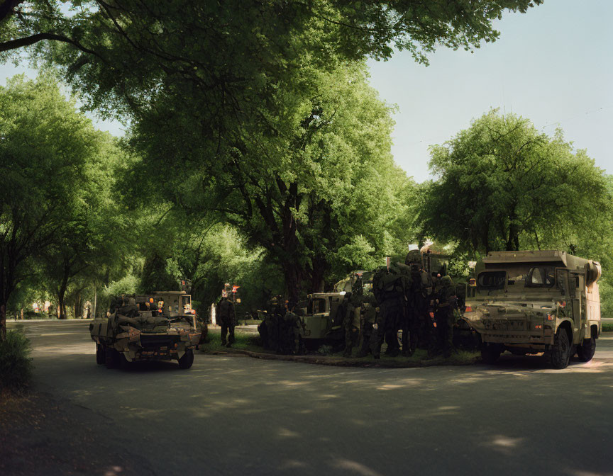 Military Personnel Gather by Armored Vehicles in Peaceful Street