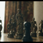 Black and Gold Ornate Chess Pieces on Glossy Surface