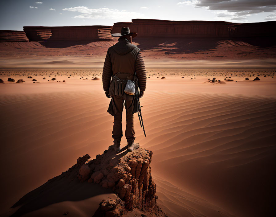 Figure in Hat and Coat with Rifle in Desert Landscape