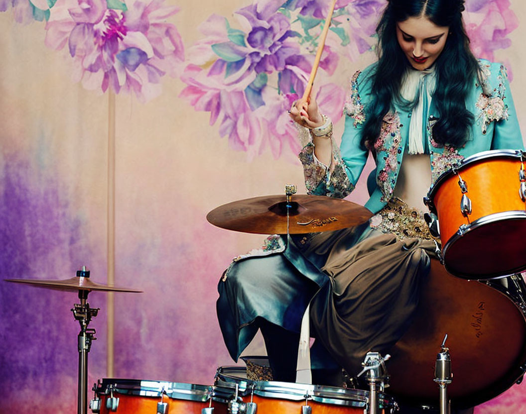 Dark-haired woman in floral outfit playing drums against flower backdrop