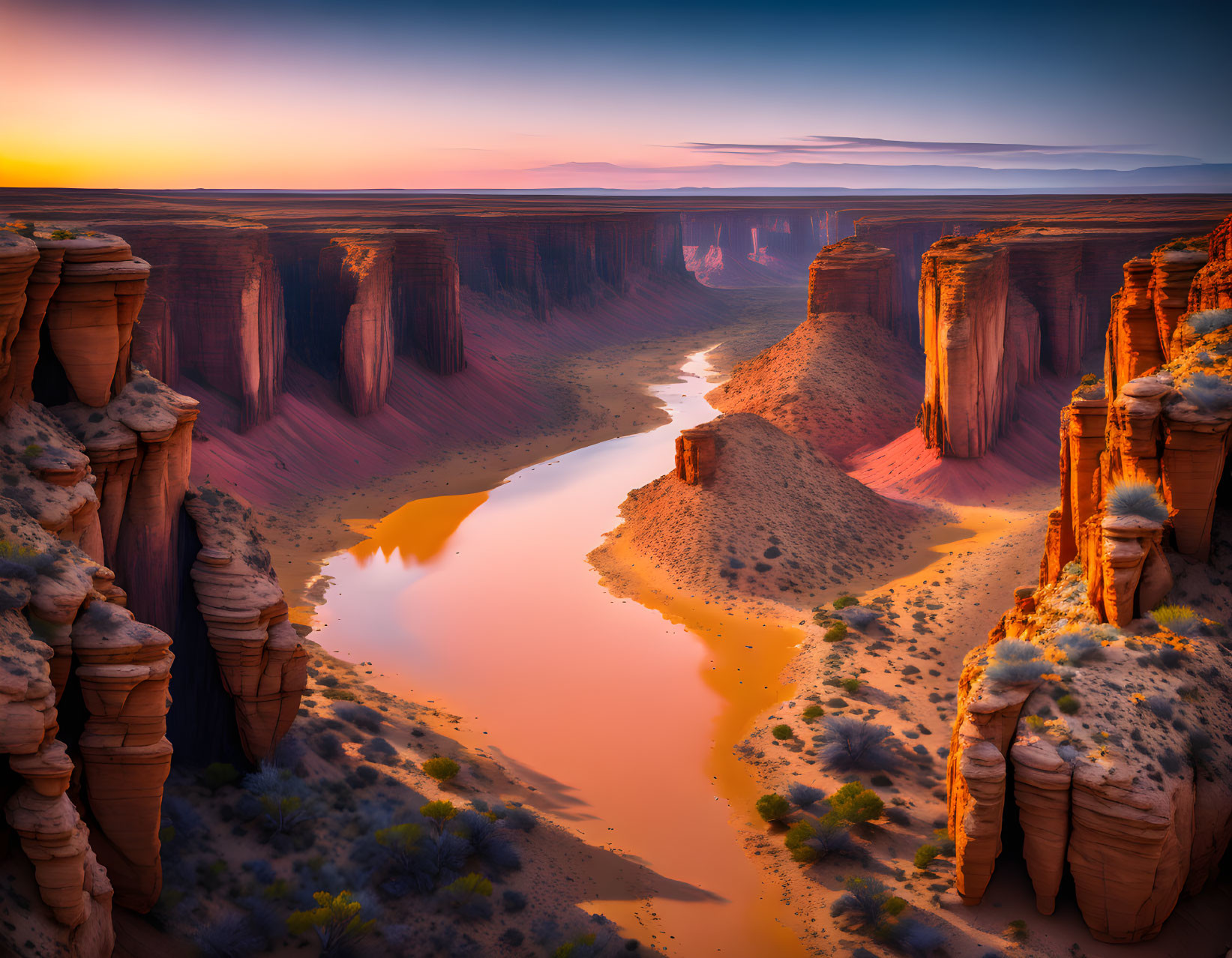 Scenic sunset over meandering river in deep canyon