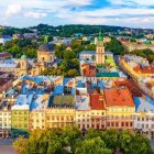 European town painting with colorful buildings and church spires