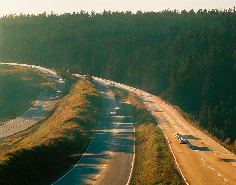 Scenic highway with cars amid rolling hills and forest landscape